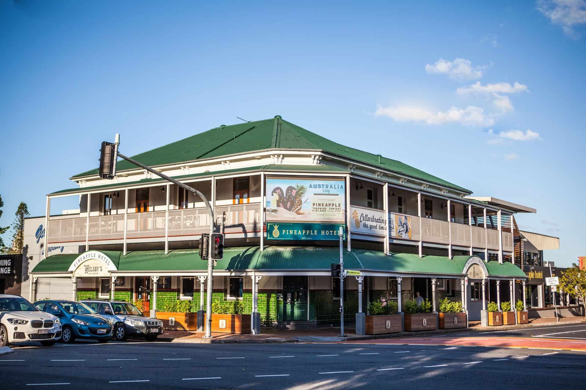 View of the Pineapple Hotel from Mains Road intersection during the day